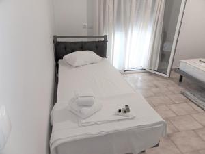 Posteľ alebo postele v izbe v ubytovaní Fiona Seafront Apartments