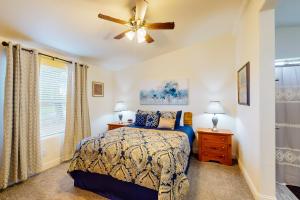 a bedroom with a bed and a ceiling fan at Apache Abode in Show Low