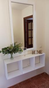 a bathroom with a white sink and a mirror at APARTAMENTO PLAYA AZUL in Rincón de la Victoria