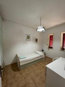 a bedroom with a bed in the corner of a room at VILLABRI in Maratea