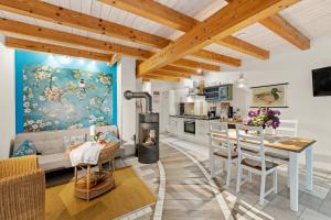 a kitchen and living room with a table and chairs at Plau Lagoons in Plau am See