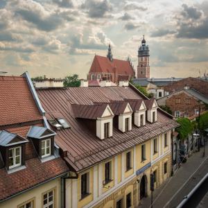 a view of a city with buildings and a clock tower at Kazimierz Secret in Krakow +120 photos
