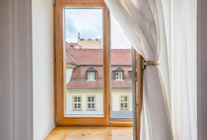 a window with a view of a building at Kazimierz Secret in Krakow