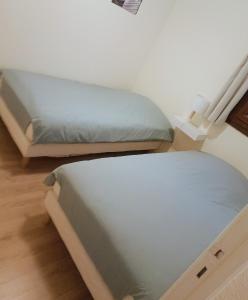 Cama o camas de una habitación en Les Ecureuils "Les Cerfs"