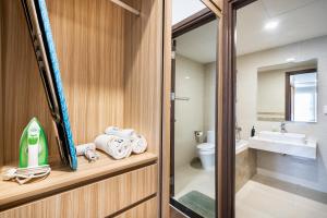 a bathroom with a toilet and a sink at MIN' Apartment - Saigon Royal - Upscale Apartment - near Ben Thanh - Downtown in Ho Chi Minh City +186 photos