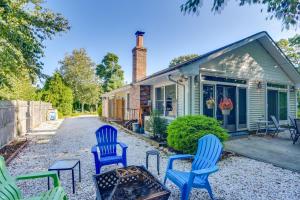 a group of blue chairs in front of a house at Westerly Vacation Home: Town Beach Access in Westerly
