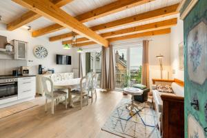 a kitchen and dining room with a table and chairs at Plau Lagoons in Plau am See