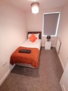 Ένα ή περισσότερα κρεβάτια σε δωμάτιο στο Apollo Avenue Apartment