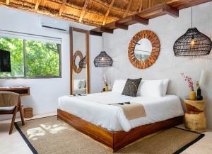 Postel nebo postele na pokoji v ubytování Terasu Riviera Maya Hotel & Spa, en Xcaret