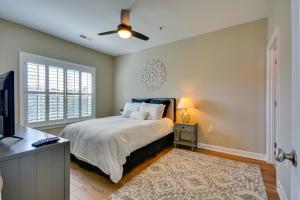 a bedroom with a bed and a ceiling fan at Greensboro Condo Rental Near Hospital and Trails! in Greensboro