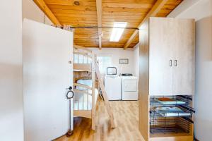a room with a staircase and a washer and dryer at Sea Mist in Rockaway Beach +18 photos