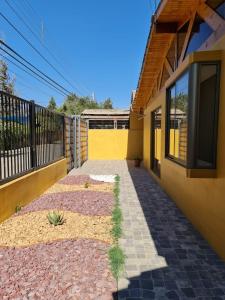 a walkway leading to the side of a house at Casa Los Andes in Los Andes