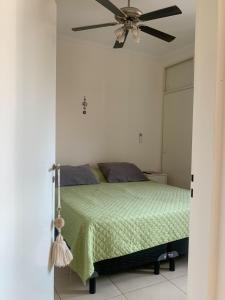 a bedroom with a bed with a ceiling fan at Urban Pulse in San Miguel de Tucumán