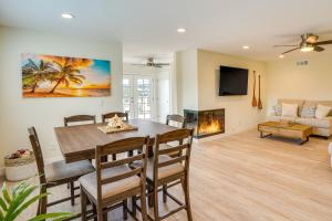 a dining room with a table and a fireplace at Ocean-View Oasis Steps to Dana Point Beaches! in Dana Point