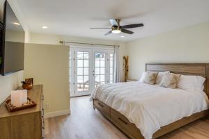 a bedroom with a bed and a ceiling fan at Ocean-View Oasis Steps to Dana Point Beaches! in Dana Point