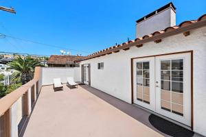 a balcony of a house with two chairs at Ocean-View Oasis Steps to Dana Point Beaches! in Dana Point