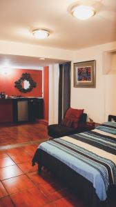 a hotel room with two beds and a fireplace at Departamento allende antiguo in Oaxaca City