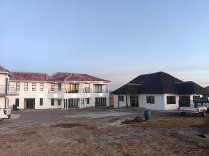 a large white building with a large courtyard at Ngqamakwe Luxury Guest House and Conference Centre in Nqamakwe