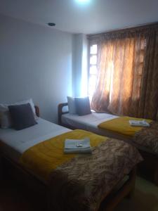 Postel nebo postele na pokoji v ubytování Hotel Torreon De Rionegro