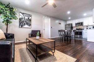 a living room with a couch and a table at Roomy Urban Apartment Montrose! Free Parking #8 in Houston