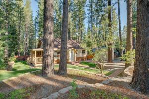 a log home in the woods with trees at Serene South Lake Tahoe Getaway with Spacious Deck! in South Lake Tahoe