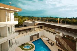 an aerial view of a building with a swimming pool at Hotel Santa Sofia in Puerto Salgar