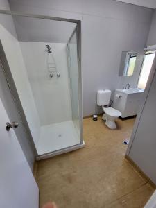 a bathroom with a shower and a toilet at Everlasting Guesthouse Morowa in Morawa