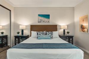 a bedroom with a large bed and two night stands at Kapalua Golf Villa 21V 1 in Kahana +37 photos