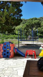 a playground with a slide at Apartments Beba Zalad in Sutomore