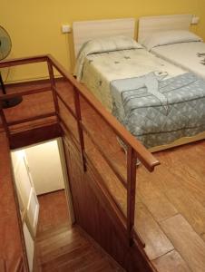 two bunk beds in a room with a mirror at Casa Violetta, Historic Center in Colonno