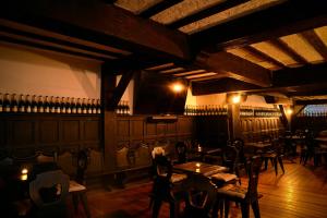 a bar with tables and chairs in a room at Mansión Papilio in Mexico City