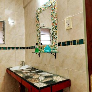 a bathroom with a sink and a mirror at Mi depa en Esquel in Esquel