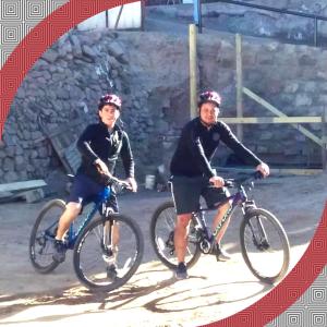 two men on bikes posing for a picture at RESIDENCIAL RESTORANT BACIAN in Pozo Almonte