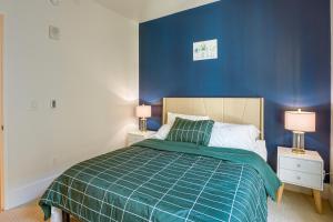 a bedroom with a bed with a blue wall at San Francisco Condo Less Than 1 Mi to Union Square! in San Francisco
