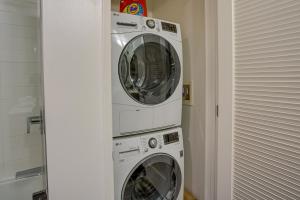 two washing machines stacked on top of each other in a room at San Francisco Condo Less Than 1 Mi to Union Square! in San Francisco