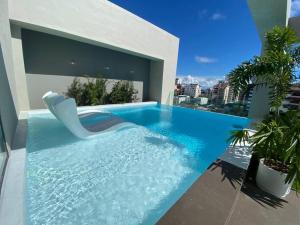 Bazén v ubytování Apartamento luxury con piscina en el area común D.N nebo v jeho okolí