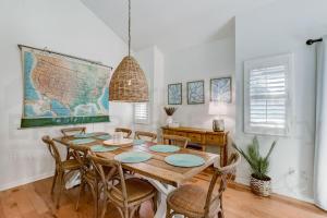 a dining room with a wooden table and chairs at 8 Sea Castles condo in Fernandina Beach