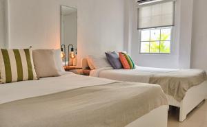 Voodi või voodid majutusasutuse The Pelican Poshtel toas