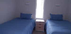 Postel nebo postele na pokoji v ubytování Apartment Twelve + 10 fotografií