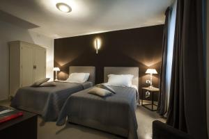 A bed or beds in a room at BB 22 Palace