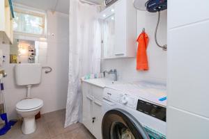 a washing machine in a bathroom with a washer at Apartments with WiFi Klenovica, Novi Vinodolski - 5530 in Klenovica