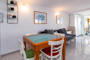 a living room with a table and a couch at Apartments with WiFi Klenovica, Novi Vinodolski - 5530 in Klenovica +17 photos