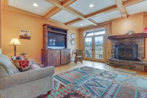 a living room with a fireplace and a tv at Lovely Big Sky Getaway Near Skiing and Golf! in Big Sky