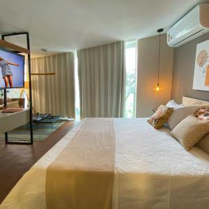Un pat sau paturi într-o cameră la Rio Holiday Mirante de Guanabara