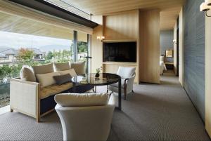 a living room with a couch and a table at Park Hyatt Kyoto in Kyoto