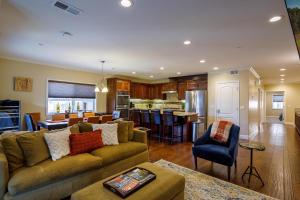 a large living room with a couch and a kitchen at Tahoe Woods Hideout in South Lake Tahoe