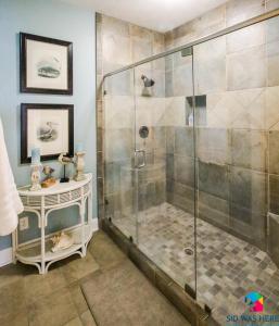 a shower with a glass door in a bathroom at Beachfront Oasis At Tybee Island in Tybee Island