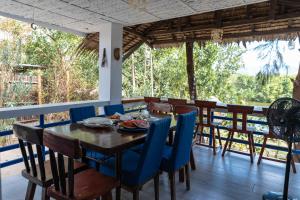 a dining room with a table and chairs at Azul Zambales Beachfront House & River Cottages EXCLUSIVE in Cabangan