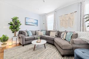 a living room with a couch and a table at Hidden Outdoor Oasis - 1 BLOCK TO KING in Charleston