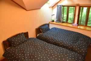 Postel nebo postele na pokoji v ubytování 木香苑